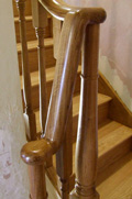 An oak ramp and wreath staircase handrail.